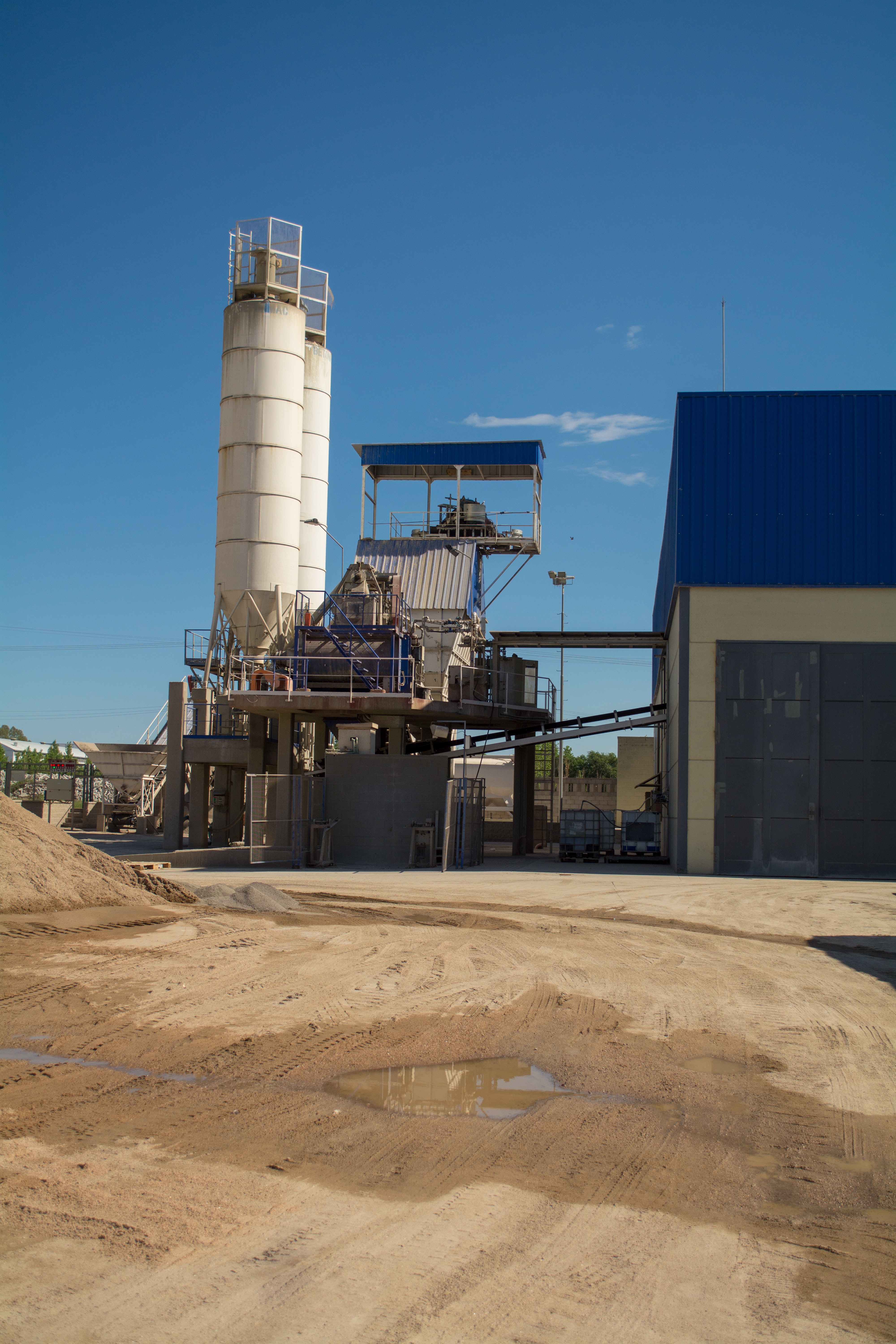 two-gray-metal-water-tanks-near-building-1058142